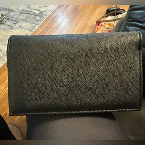 Wristlet purse, small cell holder but leg will fit inside, mirror, id holder